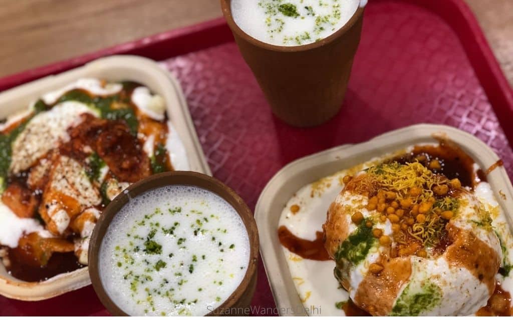 Snacks and lassi at Haldiram's in Delhi on a red tray