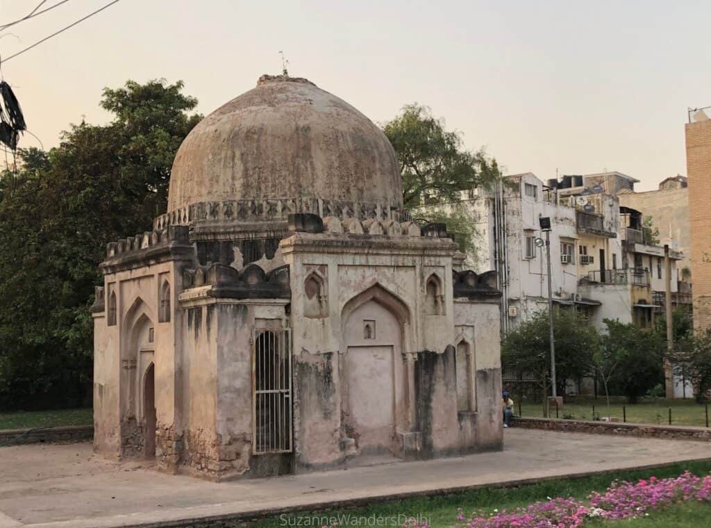 Chote Gumti, a full on view of the little white mausoleum with trees and residential buildings in the background