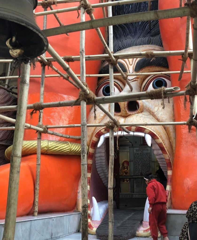 The monster mouth entrance to the tempel surounded by bamboo scaffolding