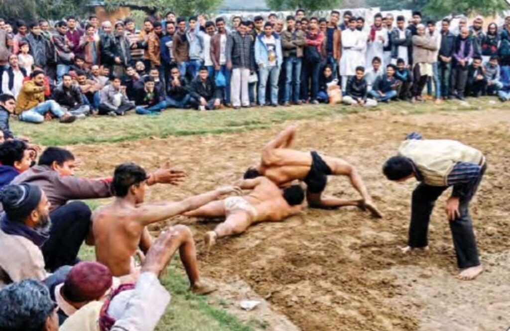 two men wrestling in Urdu Park, Delhi