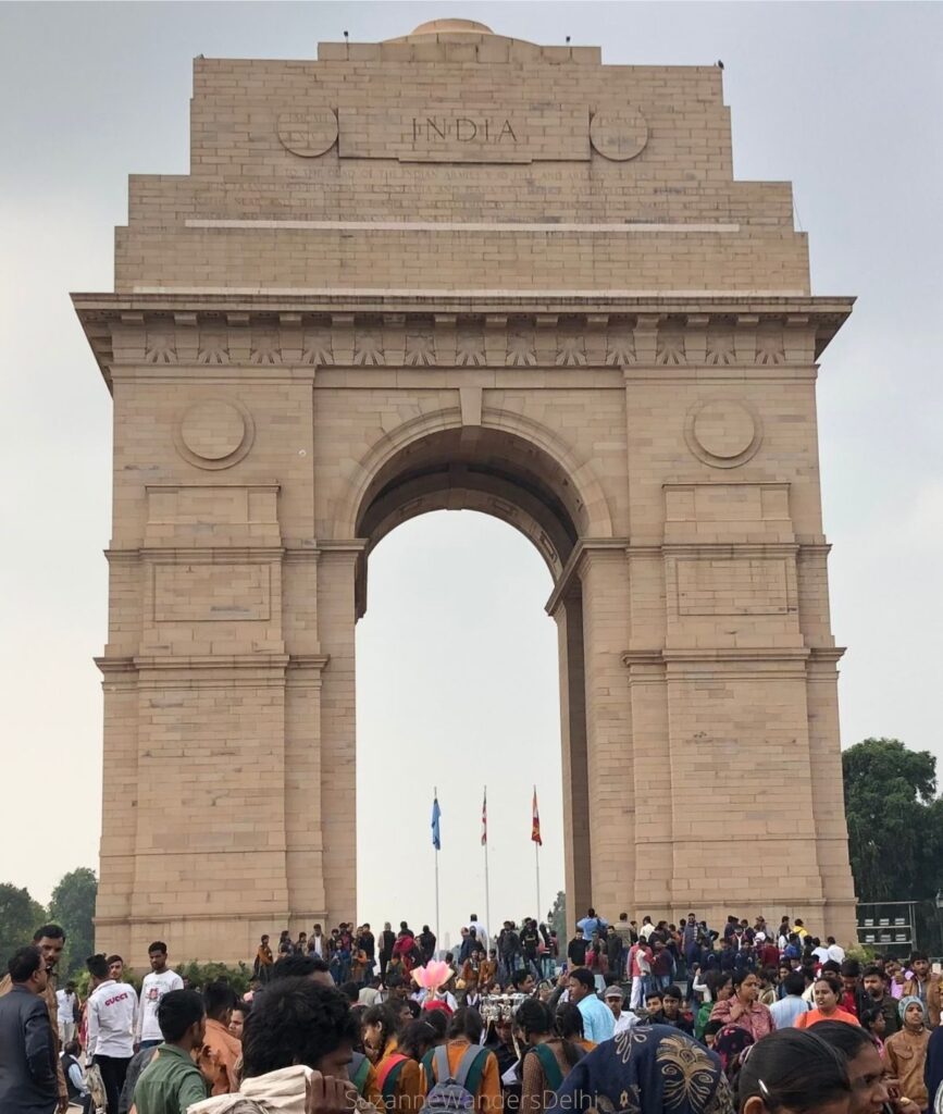 India Gate, with cloudy sky and crowds, one of the best free things to do in Delhi