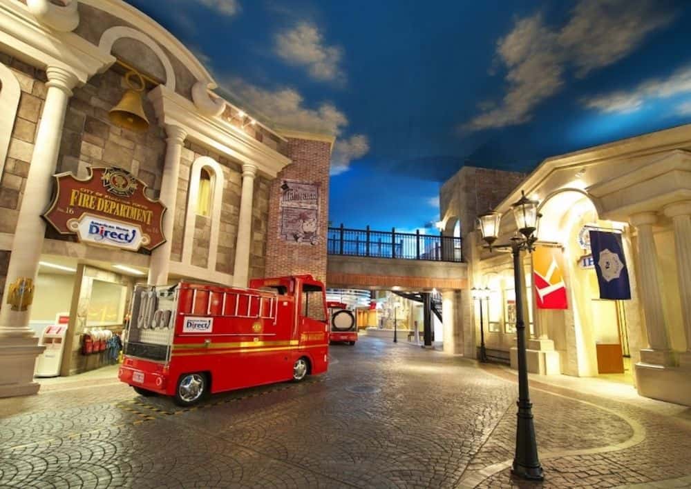 a child size fire truck outside the model fire department in Kidzania, one of the best things to do with kids in Delhi