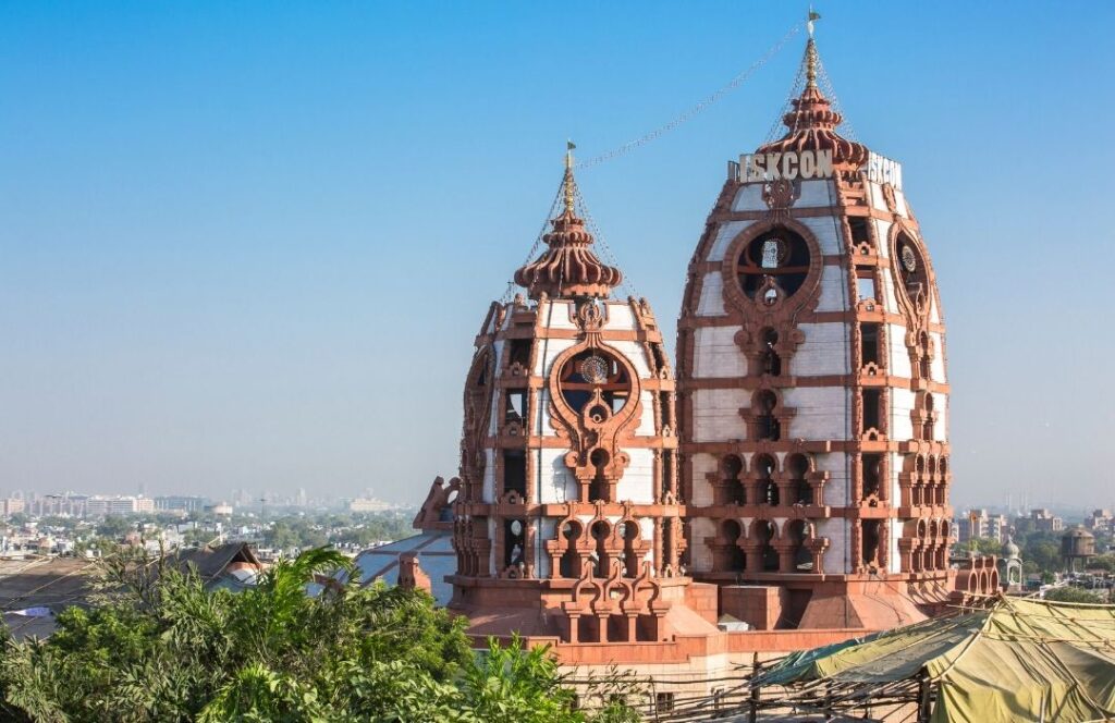 View from of distance of two white and red sandstone towers of ISKCON/21 Famous and Unique Temples in Delhi
