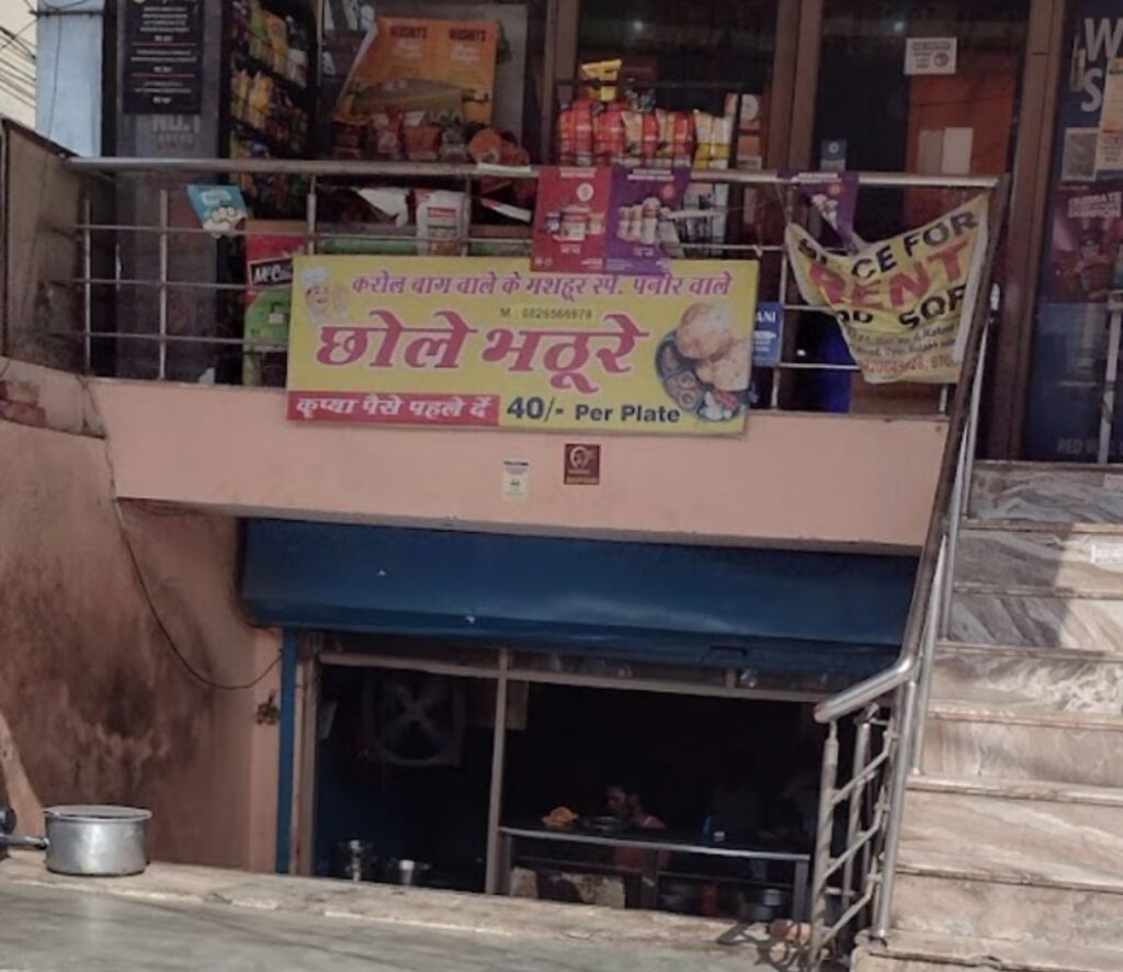 Street entrance to a simple road food shop with hindi signage