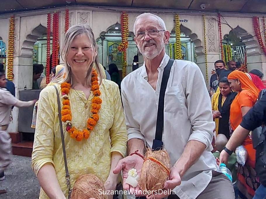 man and woman outside Kalkaji Mandir in Delhi during Navratri