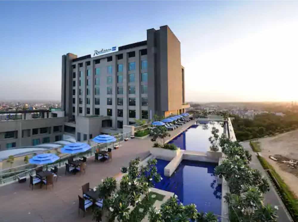 long view of the roof top pool and hotel at Radisson Blu Paschim Vihar in Delhi