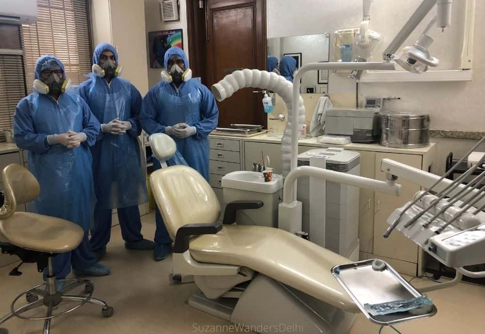 Patient care room at Dr. Poonam Batra with 3 assistants in full protective gear