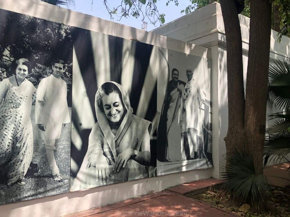 Black and white murual of scenes from Indira Gandhi's life on a white exterior wall at Indira Gandhi Memorial Museum, one of the best museums and galleries in Delhi