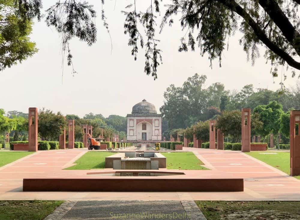 A view of Sunderwala Burj tomb from a slight distance with the grass and fountains leading up to it / Where to Go in Delhi With Your Dog - The Ultimate Guide
