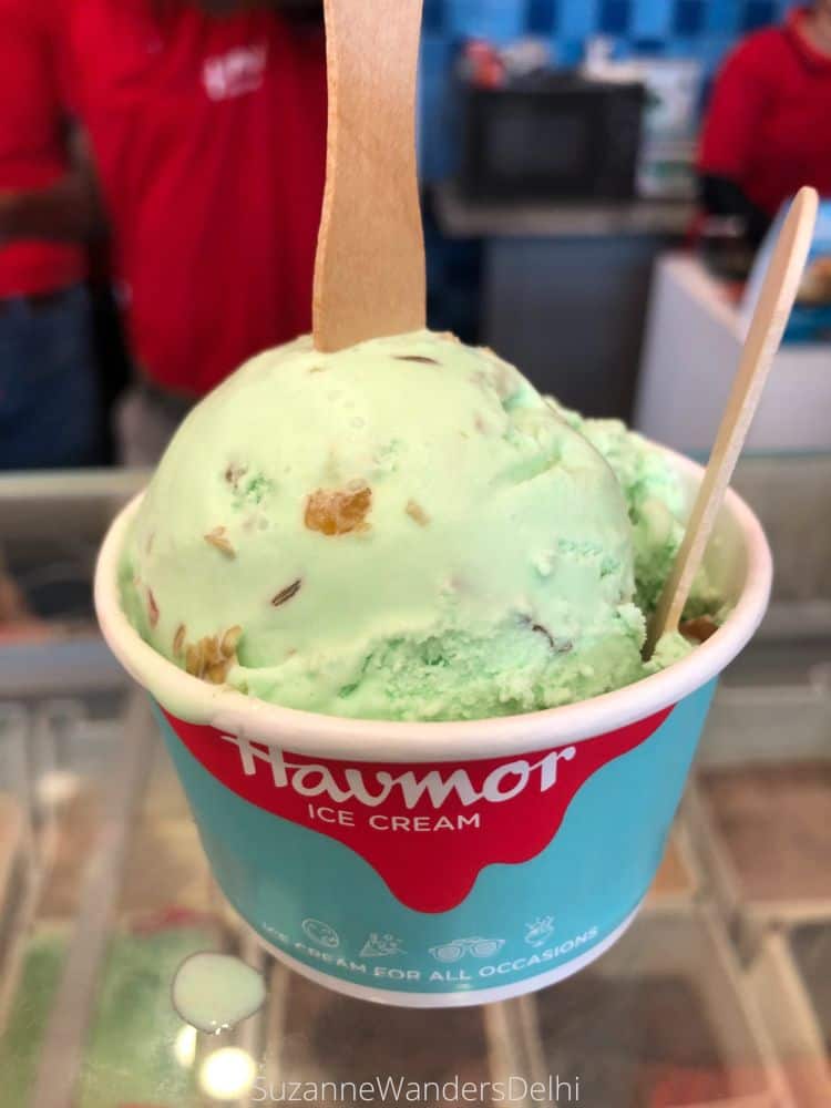 a Havmor ice cream cup filled with light green paan ice cream - Havmor is the best place in Delhi to get ice cream
