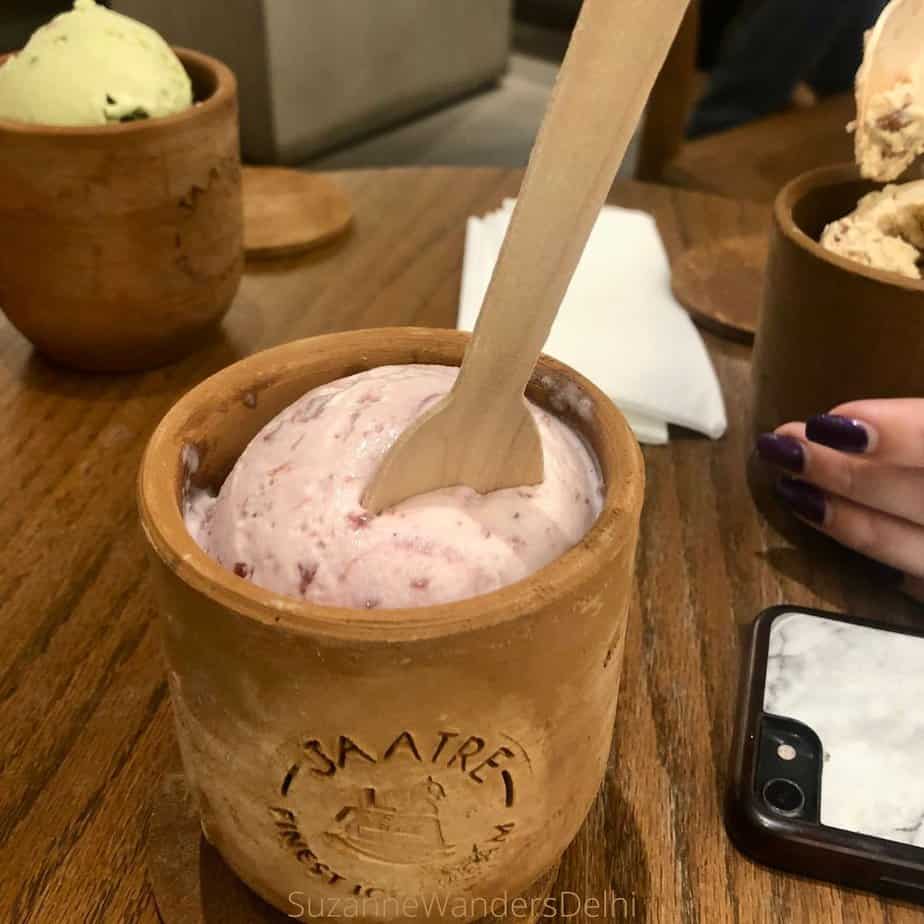 A clay terra cotta pot filled with pink cherry ice cream - Jaatre is the best place for artisanal ice cream in Delhi