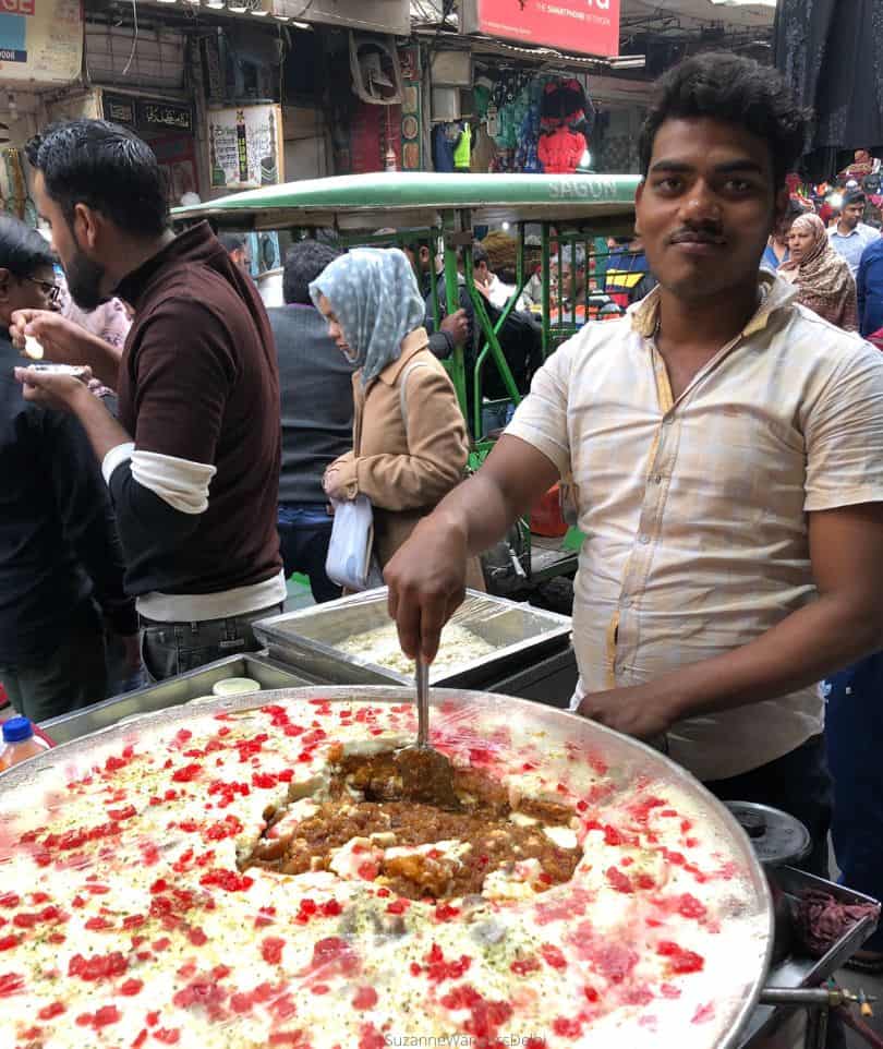 The sweet wala dishing up a serving of shahi tudka from a large vat on the streets of Old Delhi