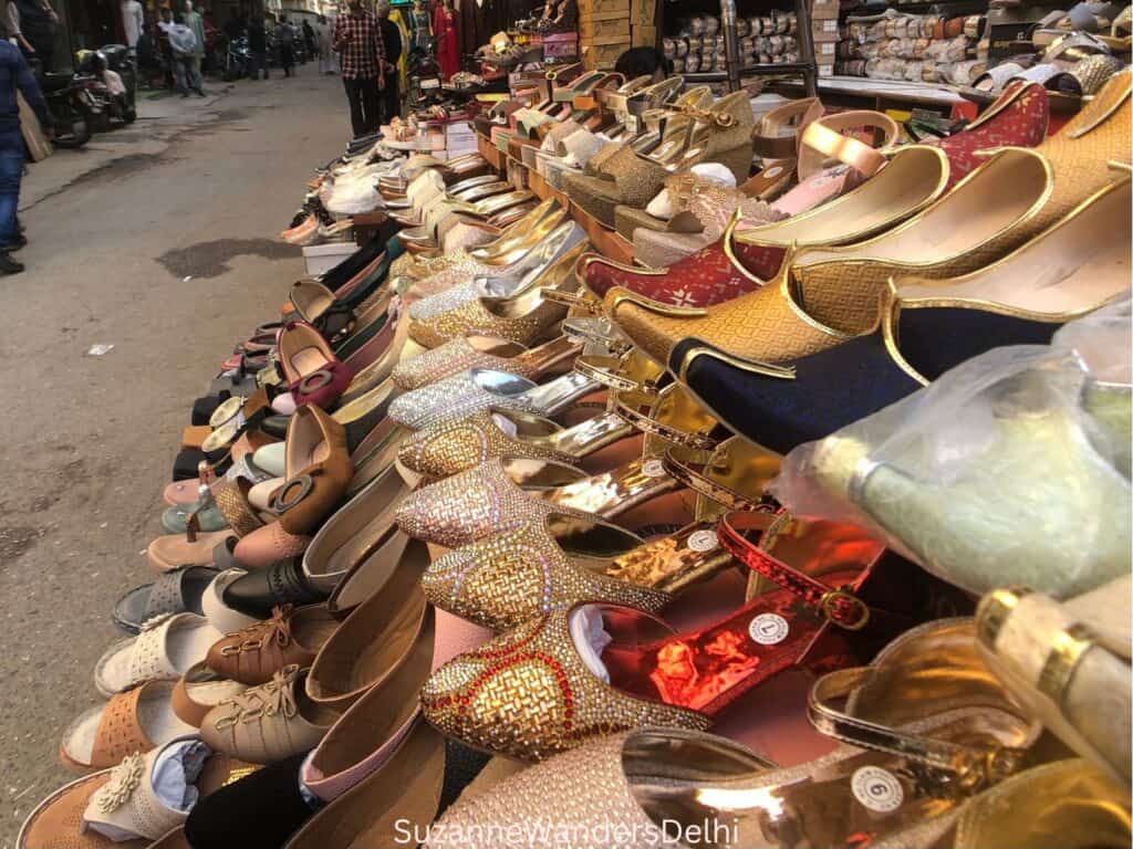 Display of shiny ladies shoes at the Karol Bagh street market