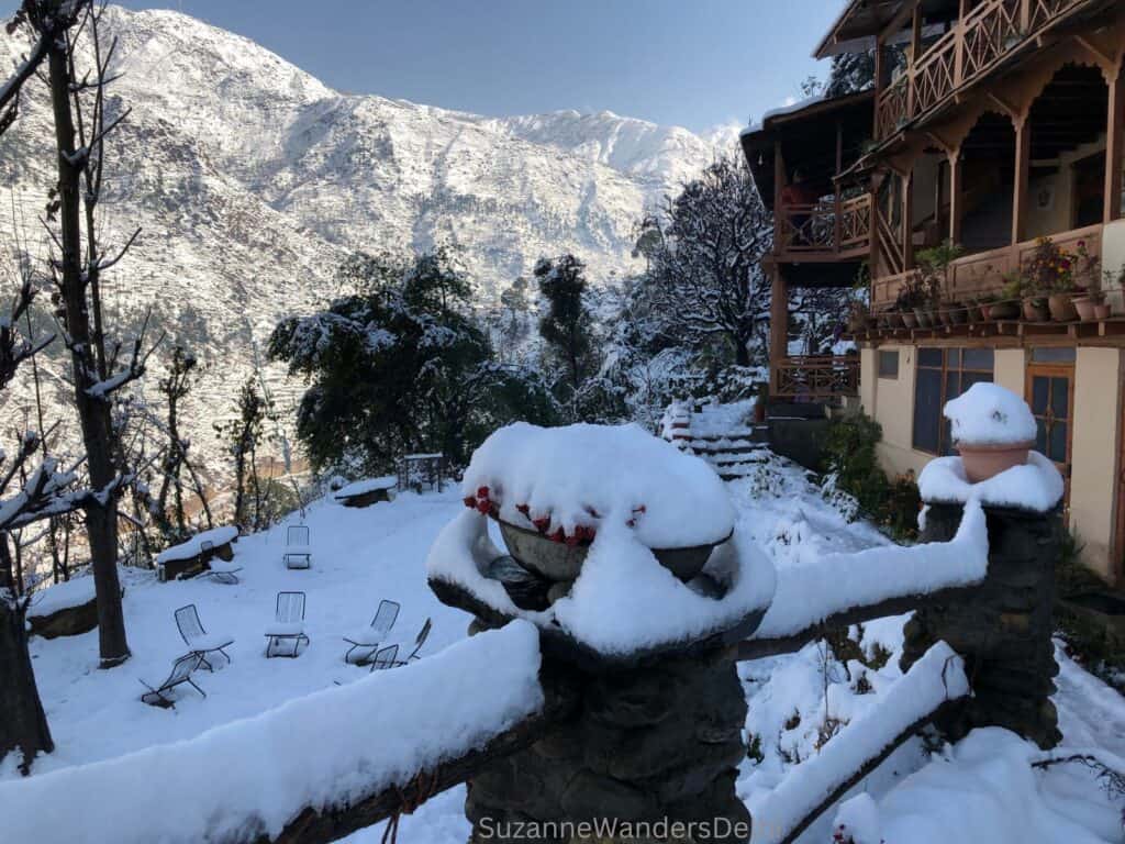 Side view of the homestay and front yard covered in fresh white snow