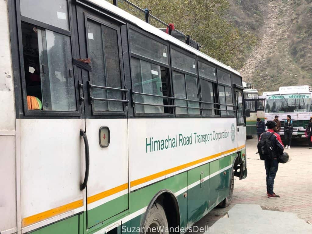 Side view of parked Himachal Road Transport Corporation bus
