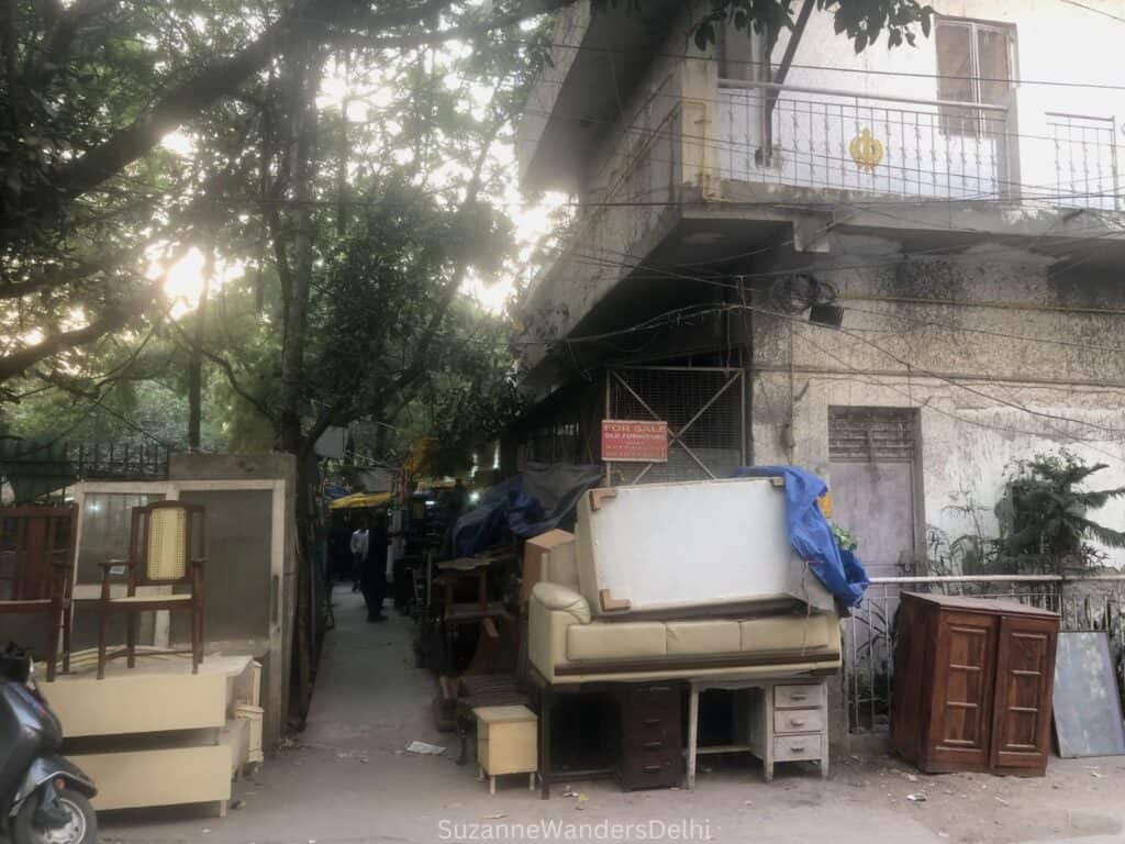 street view of lane leading to Amar Colony Furniture Market