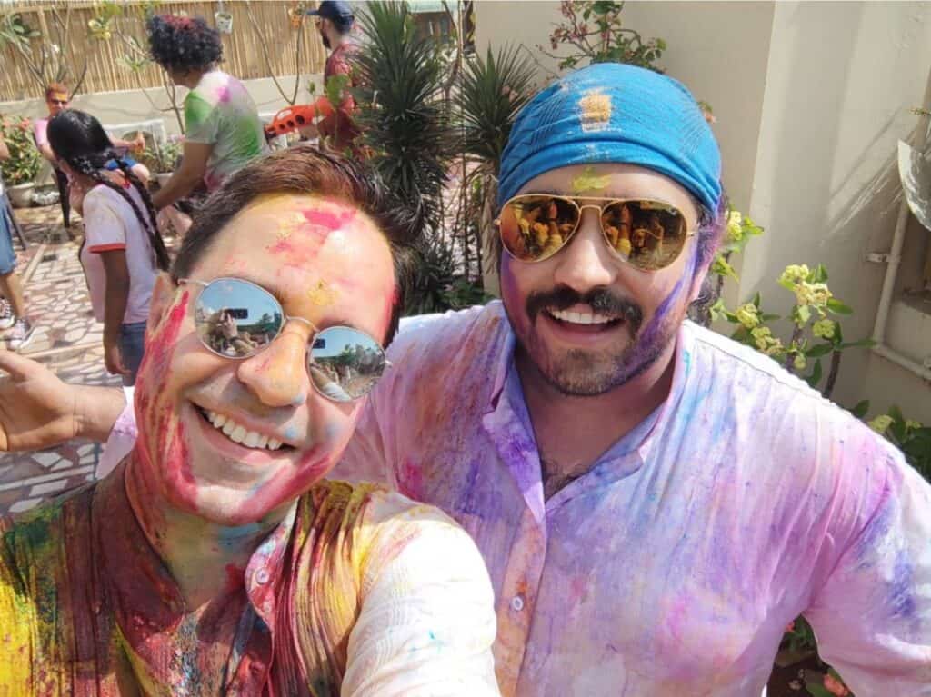 two colour drenched men at a private Holi party, the best way to celebrate and play Holi in Delhi safely
