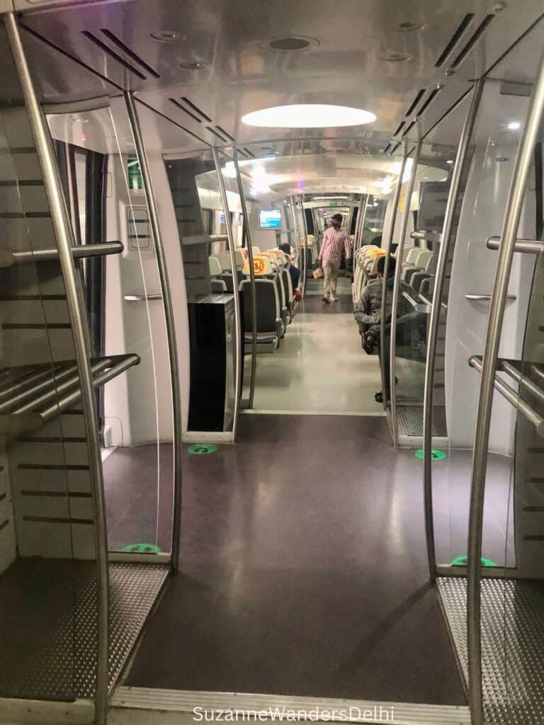 Inerior long view of the Delhi metro airport express metro line with its luggage racks