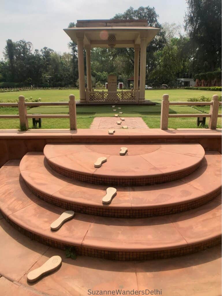 Gandhi's last footsteps leading up several stairs to a canopied martyr's column in the gardens of Birla House which should be on all Delhi itineraries
