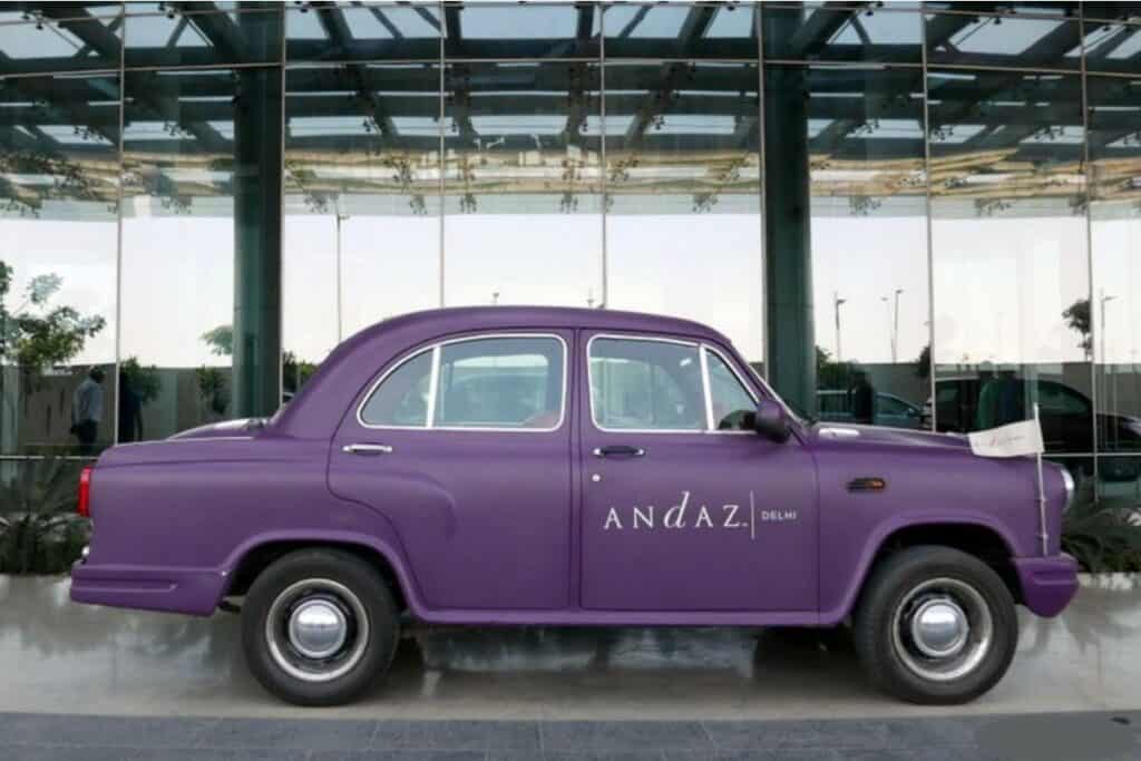 A private hotel transfer is one way to get into Delhi from the airport, like this purple Ambassador car from the Andaz Hotel