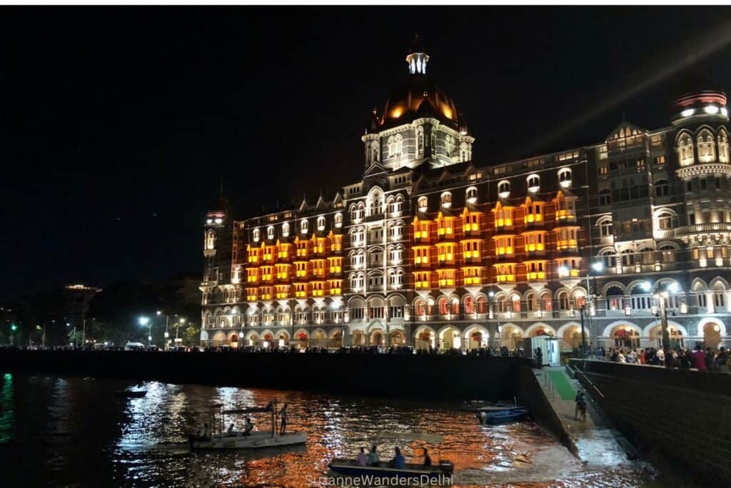 Nightime view across the seaside of the Taj Mahal Palace hotel in Mumbai, in Mumbai vs Delhi, Mumbai has better night life