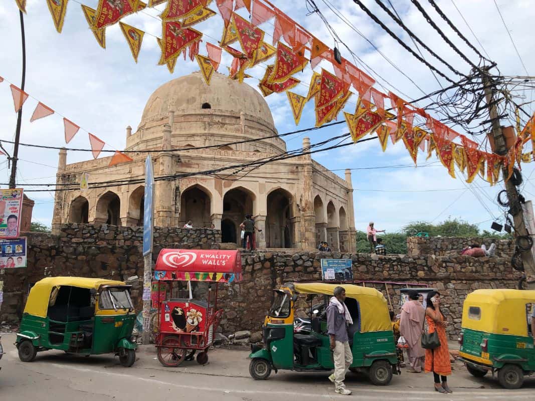 rickshaws outside a tomb in Delhi