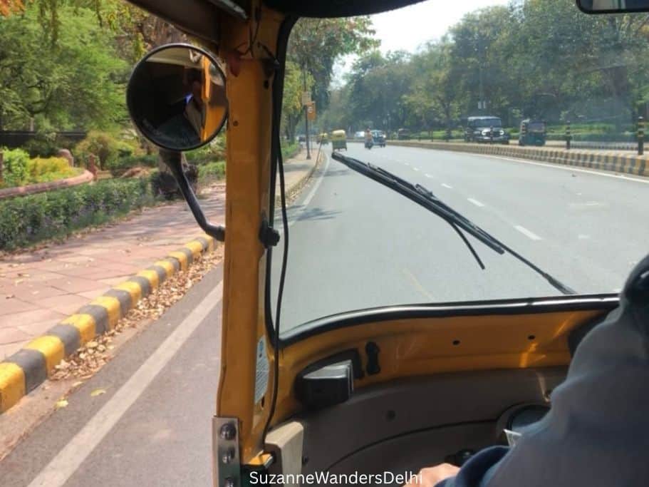 looking at New Delhi street from inside auto rickshaw, one of the most fun things to do in Delhi