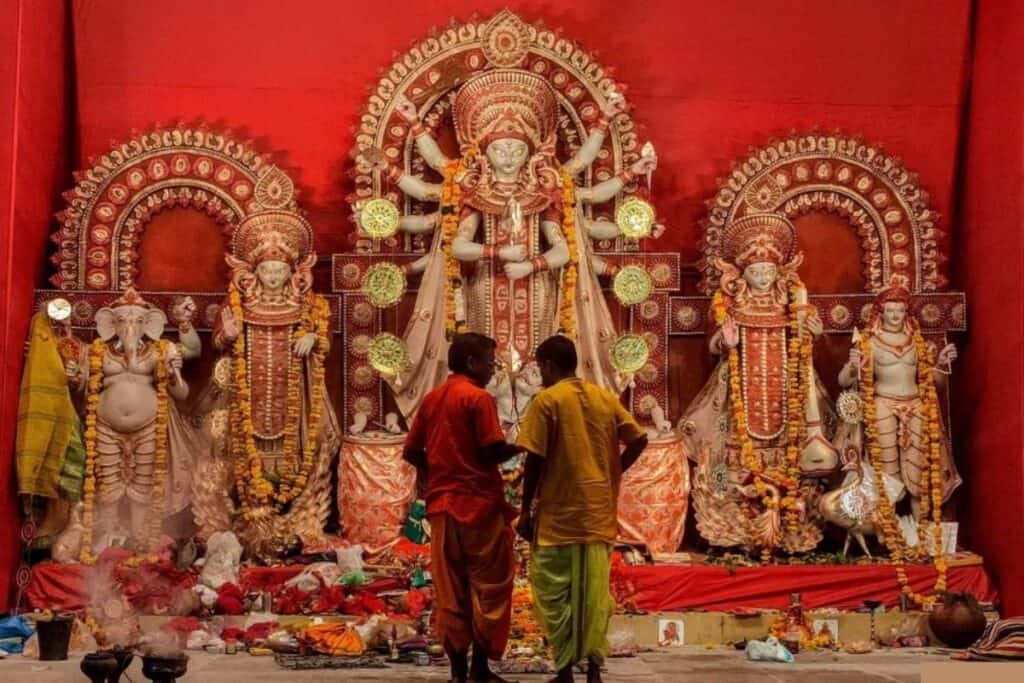 The pandal at Kali Mandir with red backdrop - one of main places to celebrate Durga Puja in Delhi
