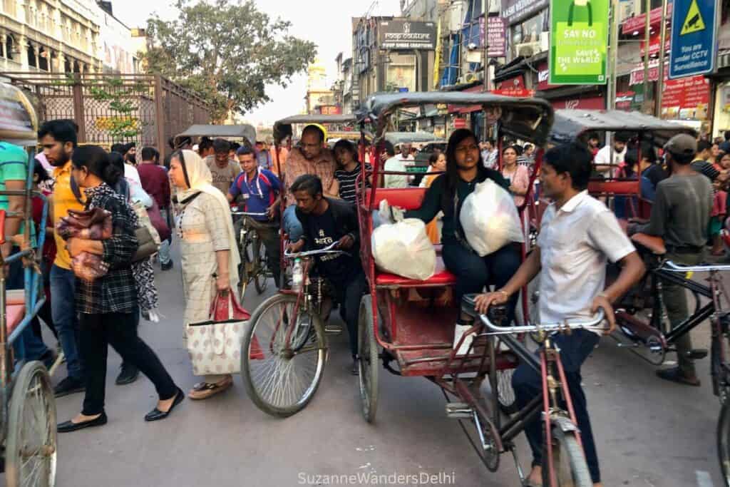Chandni Chowk crowded with cycle rickshaws and pedestrians, taking a cycle rickshaw is one of the top things to do in Old Delhi