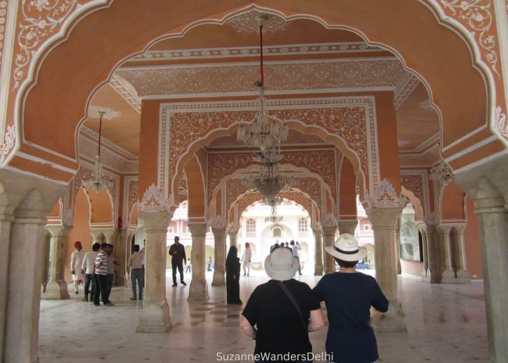 City Palace in Jaipur with arched, painted terraces and hanging chandeliers