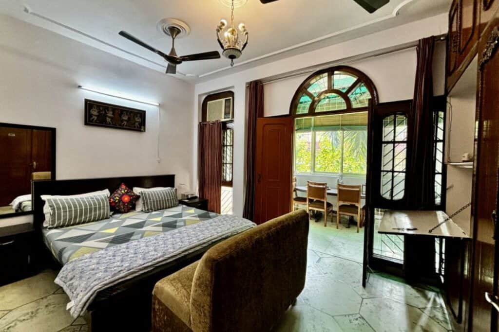 large double room with attached verandah at Tatvamansi Homestay, one of South Delhi's best hotels