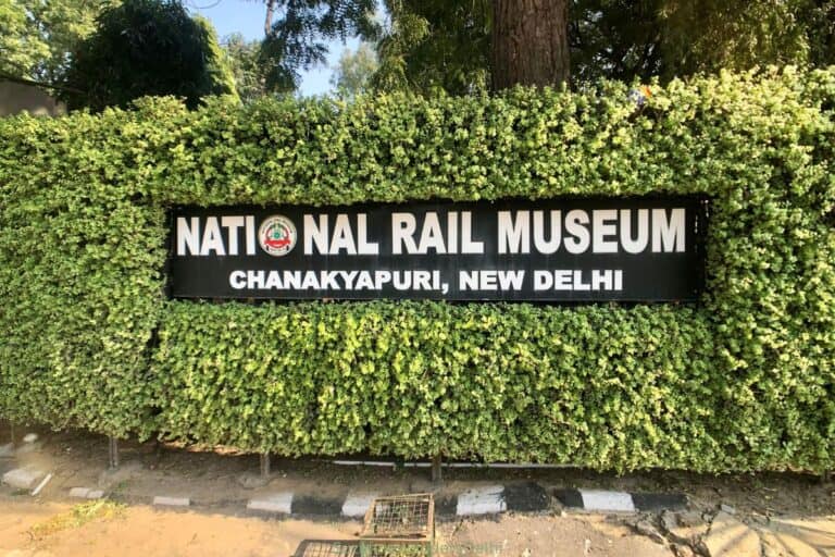 the street sign in shrubbery for the National Rail Museum in Delhi