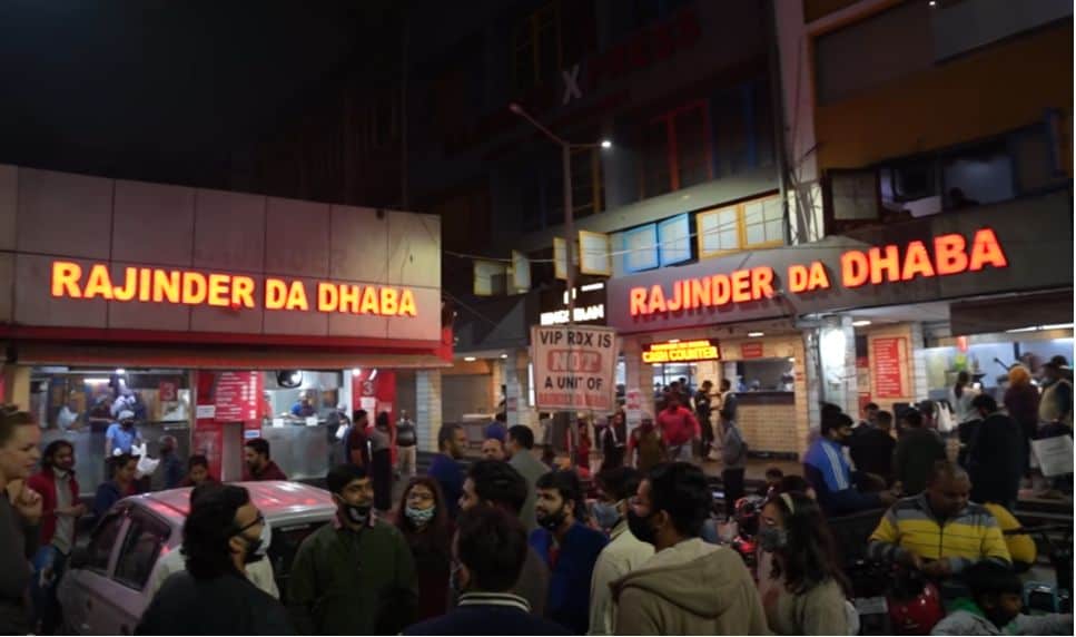 the crowded parking lot at night outside Rajinder da Dhaba, one of Delh's most famous restaurants