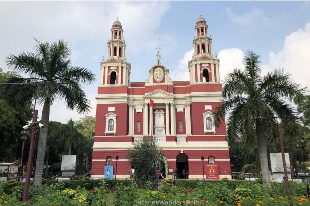 exterior full view of the famous Delhi church, Sacred Heart Cathedral, flanked by palm trees