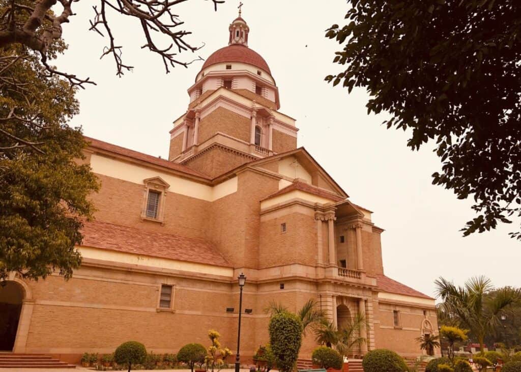 A close up of the brick church with red dome, Cathedral Church of the Redemption in Delhi