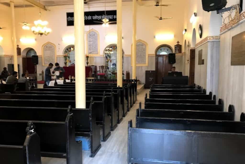 interior of Central Baptist Church with dark wood pews and light walls, a famous church in Chandni Chowk, Delhi