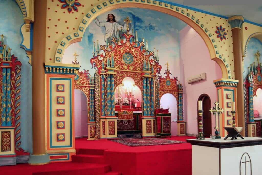 Interior of St. Peter's Jacobite Syrian Orthodox Cathedral with colourful painting of St. Thomas