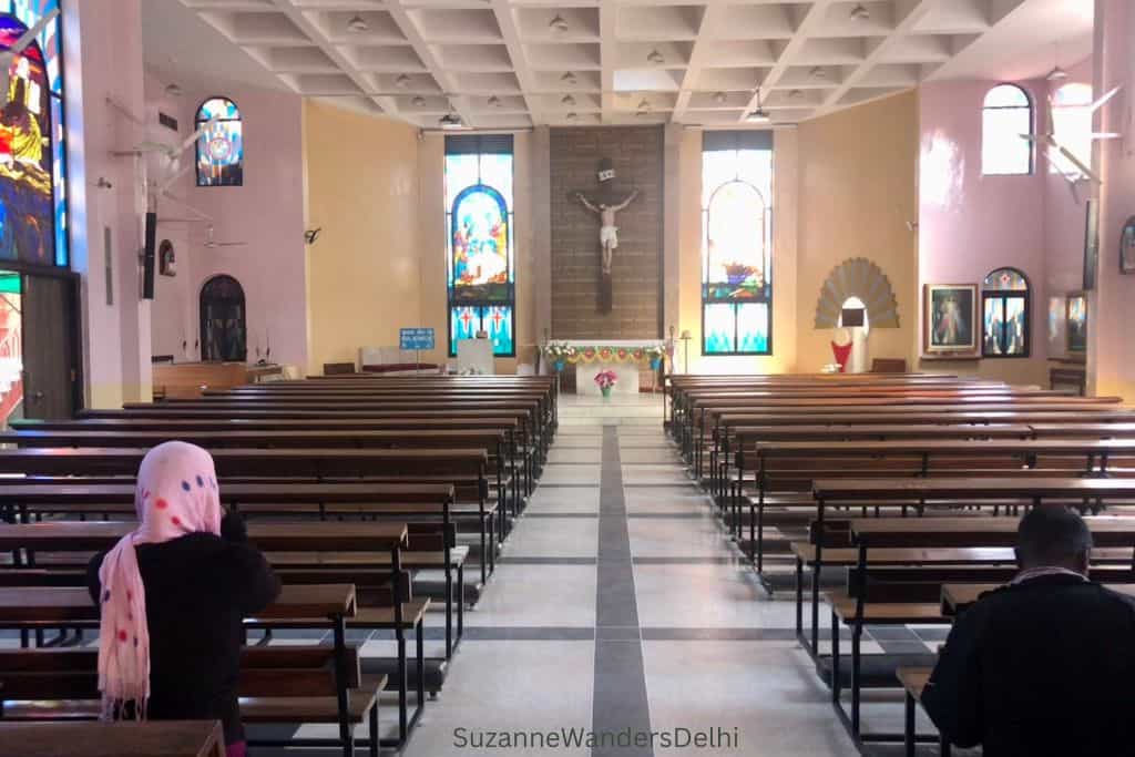 interior of St Dominic Church in Delhi with people praying