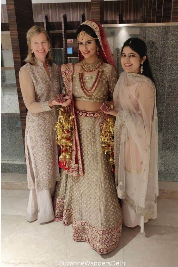 author and bride with another guest in traditional Indian clothes at Delhi wedding
