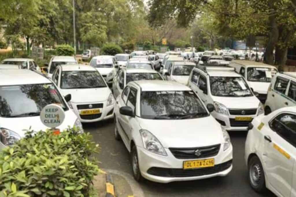 A tree lined street in South Delhi full of white Ubers