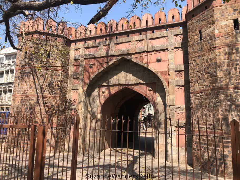 Front view of Delhi Gate with iron fence in front