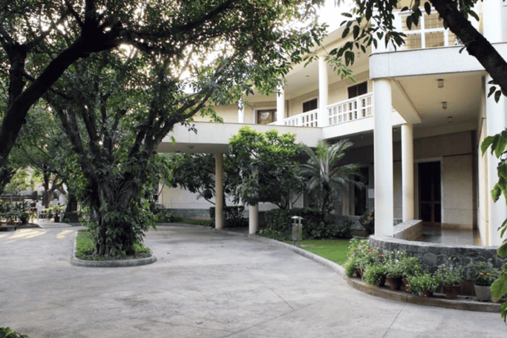 exterior of the Italian Cultural Centre in Delhi with lots of trees