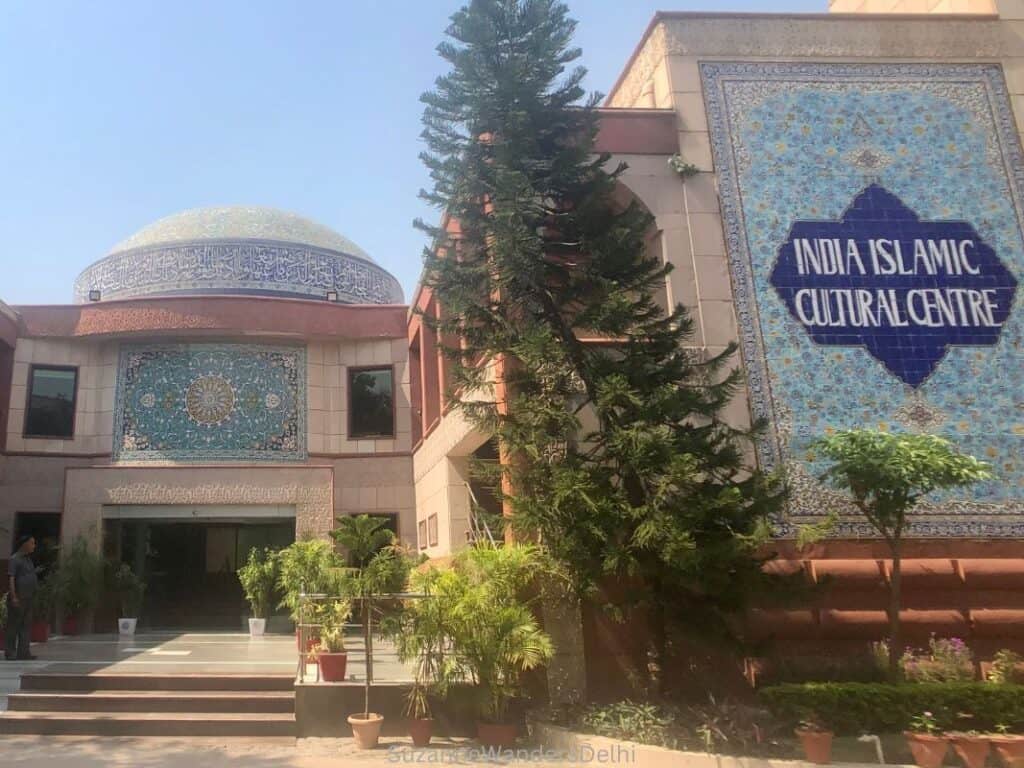 Exterior of India Islamic Cultural Centre in Delhi with blue tile work and tile domed roof