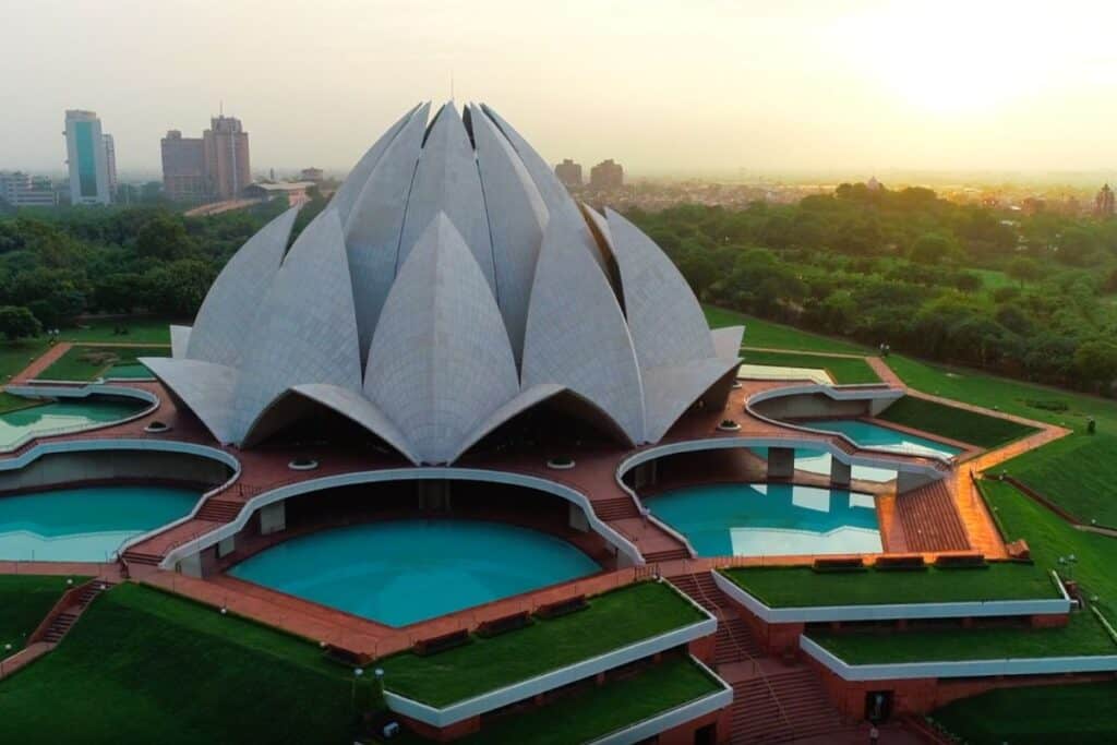 Ariel view from the side of the Lotus Temple and exteriour pools with parkland in background