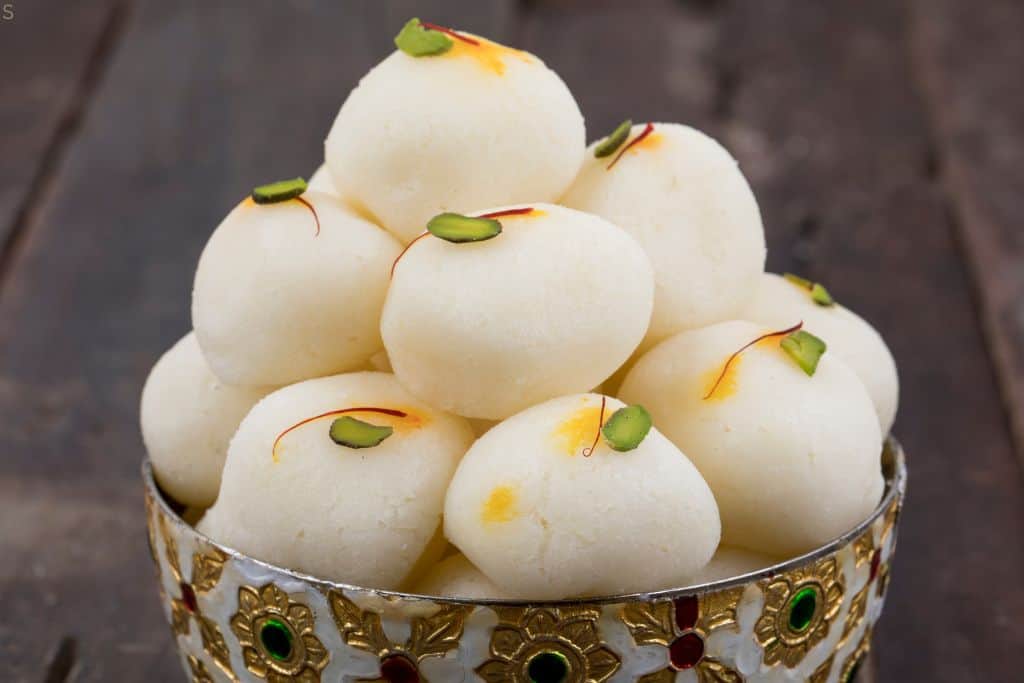 stack of rasgula in a pretty bowl