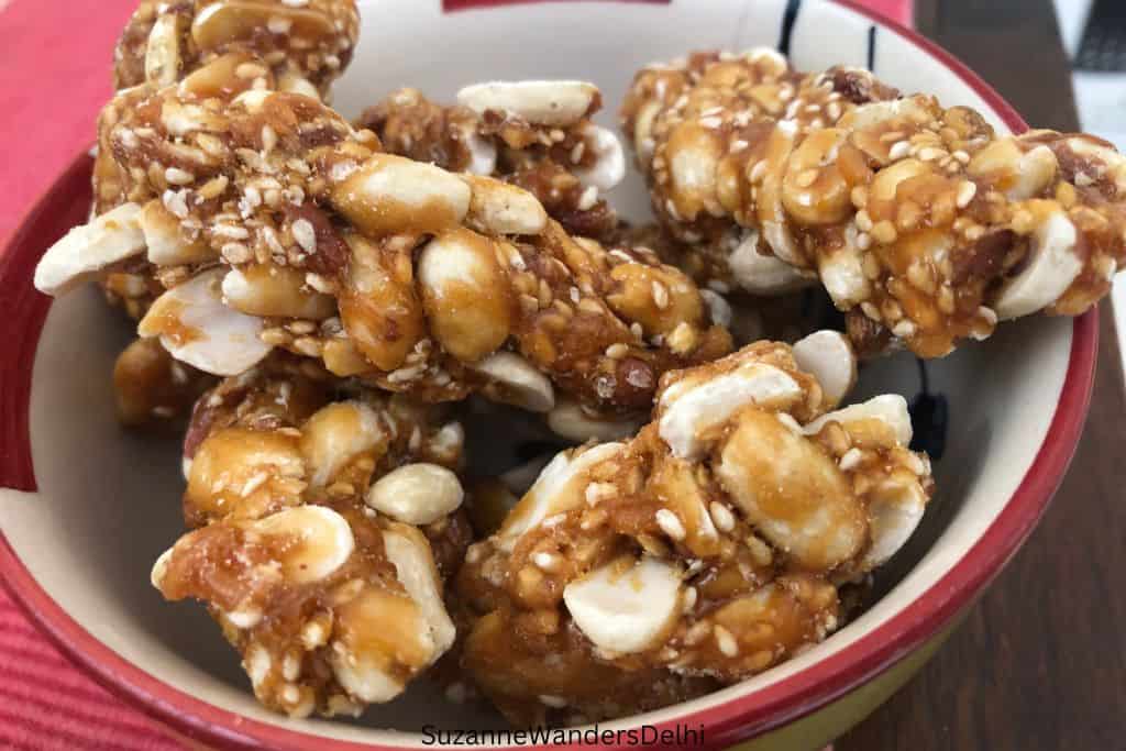 bowl of chikki with sesame and nuts