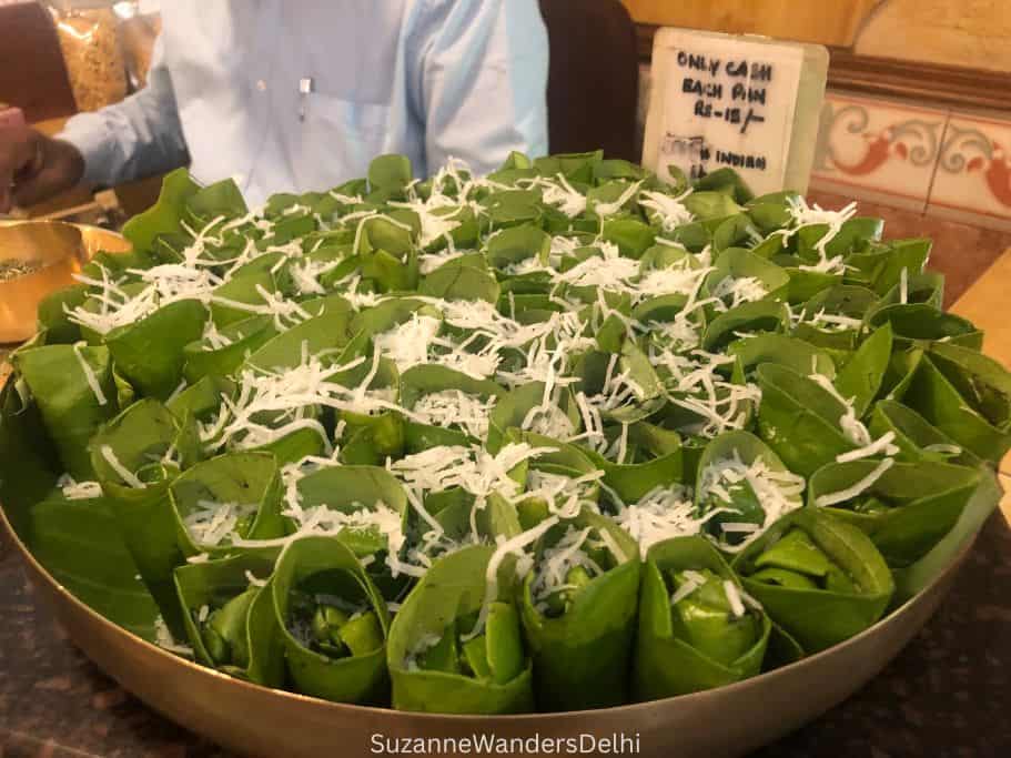 round tray full of fresh paan with grated coconut as garnish at Karnatak Sangha state bhawan in Delhi