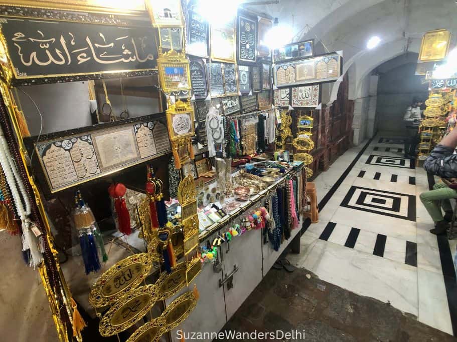 covered bazaar selling Islamic religious items behind the baoli in Nizamuddin