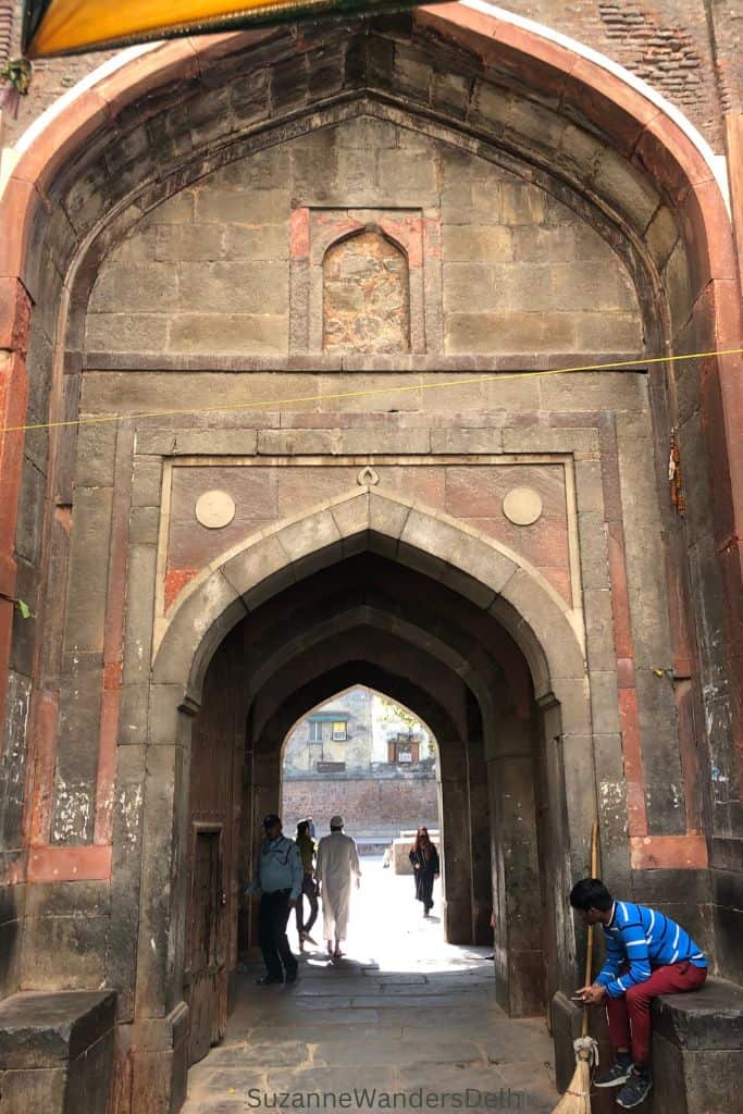 huge stone arched entrance gate to Chausath Khamba in Delhi