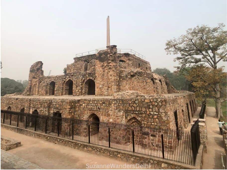 3 storied ruin with Ashoka Pillar on top at Feroz Shah Kotla Fort in Delhi